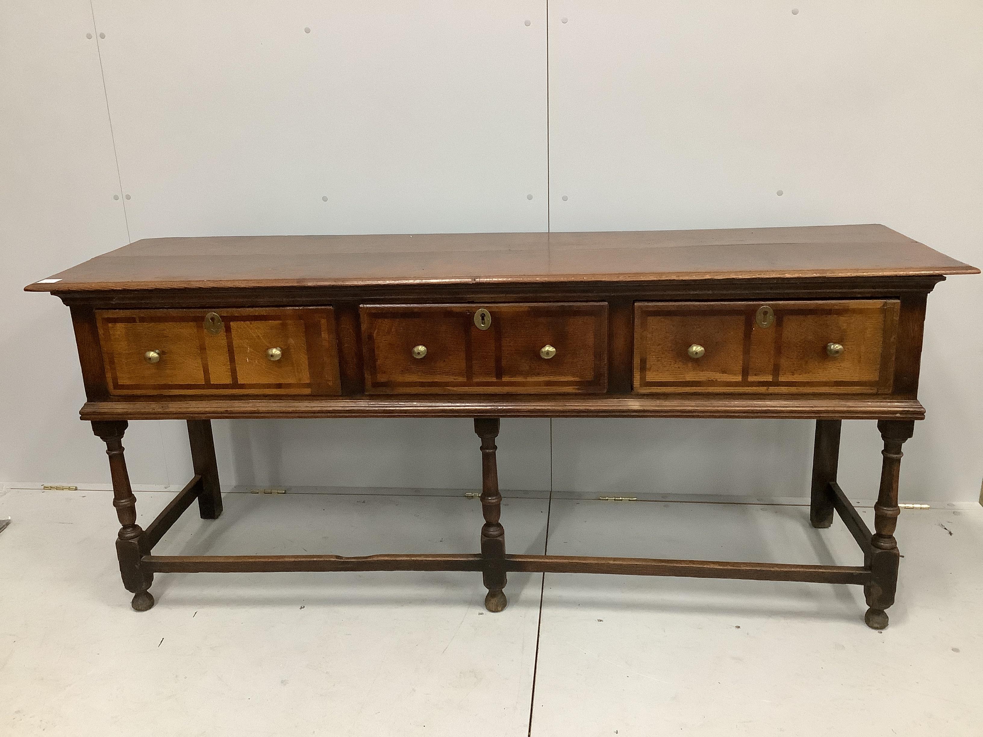 An 18th century mahogany banded oak low dresser, width 195cm, depth 54cm, height 83cm